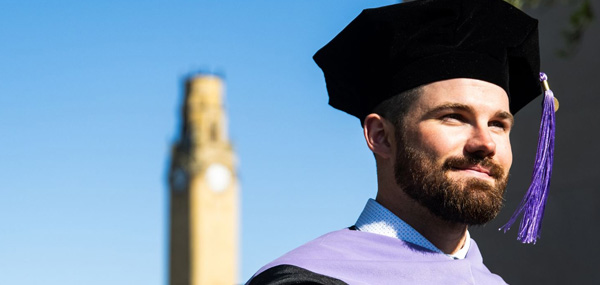 UDM student in cap and gown
